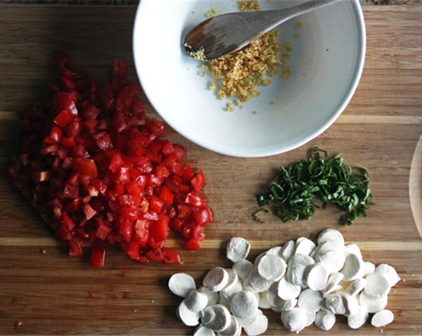 step 1 Dice the Roma Tomatoes (2 cups) and slice the Fresh Mozzarella Cheese Ball (1 1/3 cups) into small pieces, about the size of a thick coin. Chiffonade the Fresh Basil Leaves (12). Mince the Garlic (3 cloves).