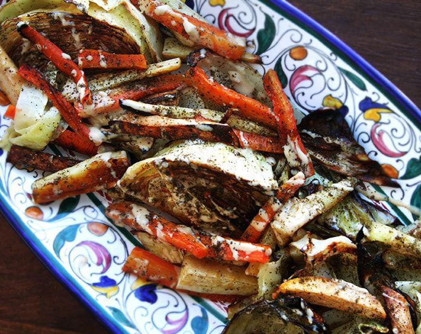 step 6 Transfer roasted vegetables to a platter. Taste one. Sprinkle vegetables with Sea Salt (to taste) and Ground Black Pepper (to taste). Spoon dressing over the top. Sprinkle Za'atar (to taste), if using.