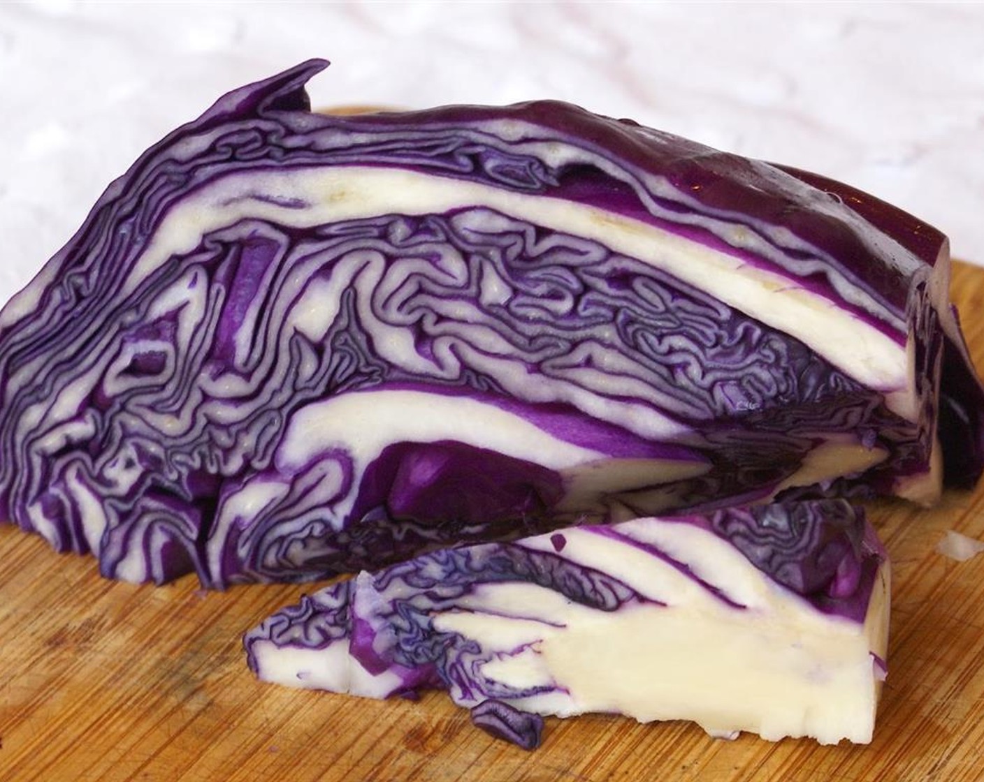 step 2 Cut Red Cabbage (1) into quarters. Remove thick white stem at the base of each quarter.