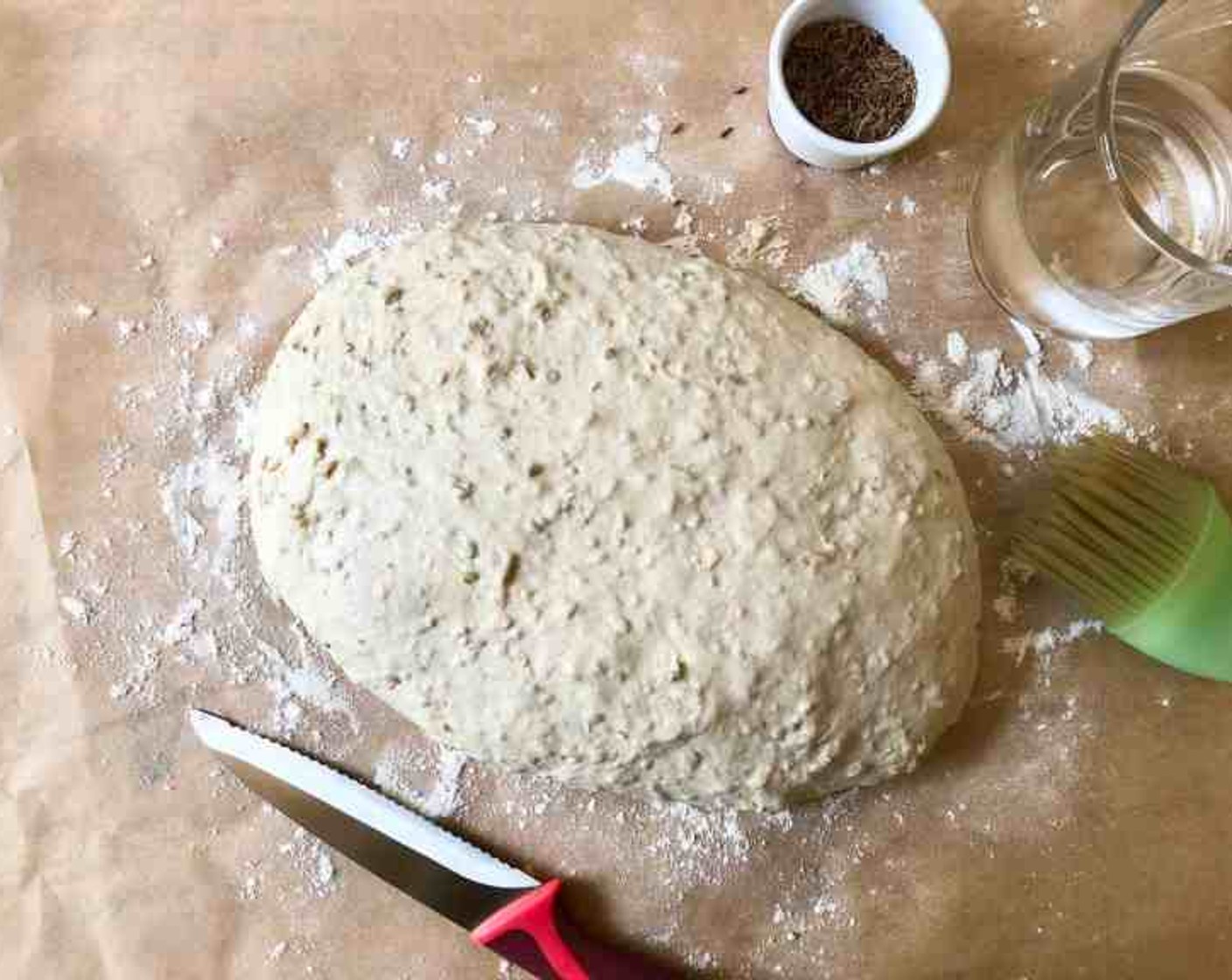 step 9 Elongate the ball to roughly form an oval loaf. By adding a generous amount of flour as you work, you are creating a “gluten cloak” on the surface of the wet dough so that it is easily shaped. Work quickly so that the entire process takes just 20 to 30 seconds. You don’t want to overwork the dough.