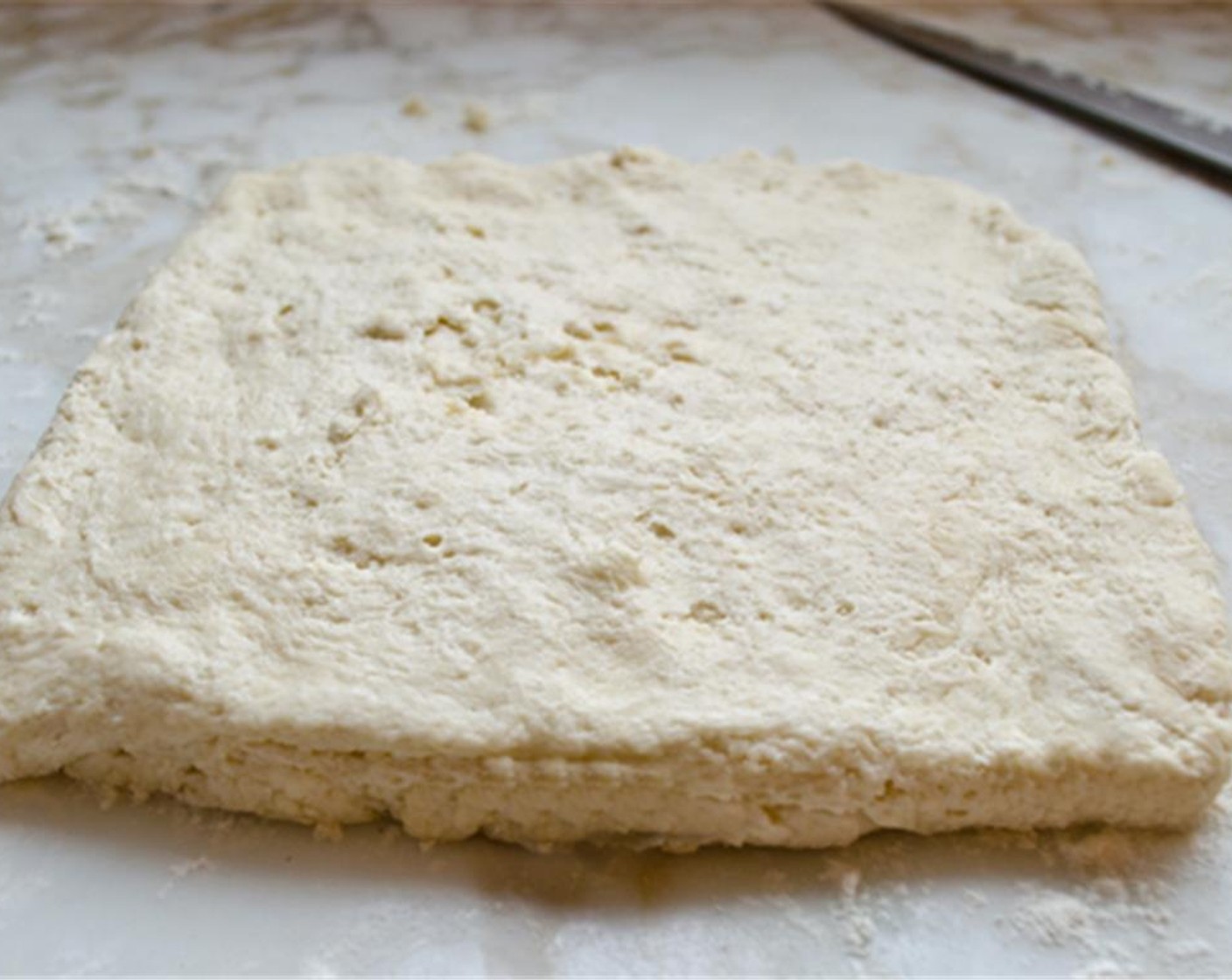 step 7 Cut the dough into thirds again. Stack the pieces on top of one another and pat into a rectangle with a final thickness of about 1/2 inch.