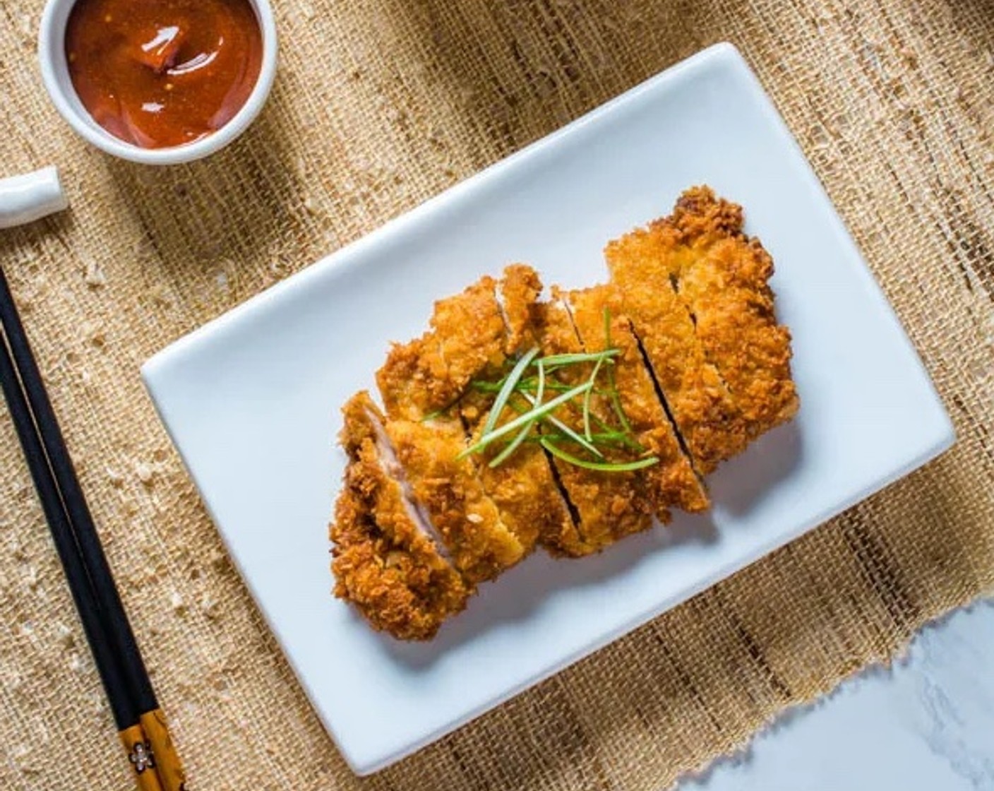 step 9 Serve the chicken katsu with steamed rice and tonkatsu sauce.