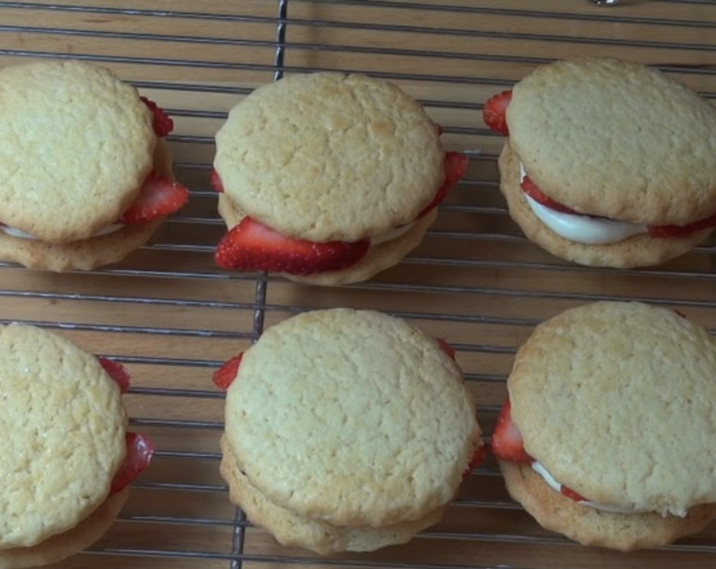 step 9 Put a small amount of the mascarpone mixture on half of the cookies. Top with Fresh Strawberries (1 2/3 cups) and then another cookie. Dust lightly with Powdered Confectioners Sugar (to taste).