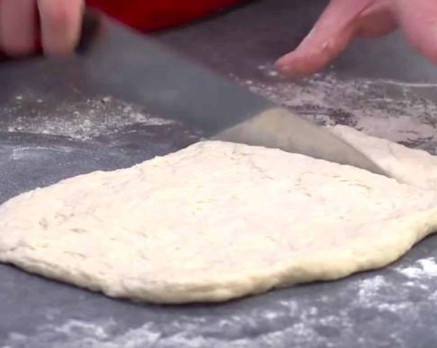 step 2 Lightly flour the surface, turn the dough onto the surface and lightly knead it until it's smooth and elastic. Use a hand to press it out until it's about 1 centimeter or half an inch thick. Take a sharp knife to cut the dough into small squares.