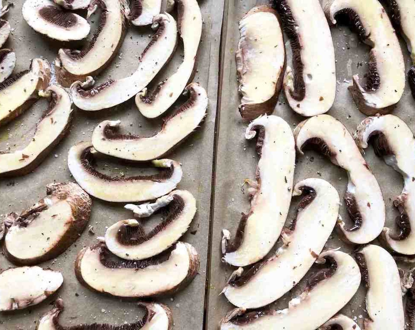 step 7 Arrange the Large Portobello Mushrooms (4) on large rimmed sheet pans lined with parchment paper. Brush generously with olive oil and sprinkle lightly with salt and pepper.