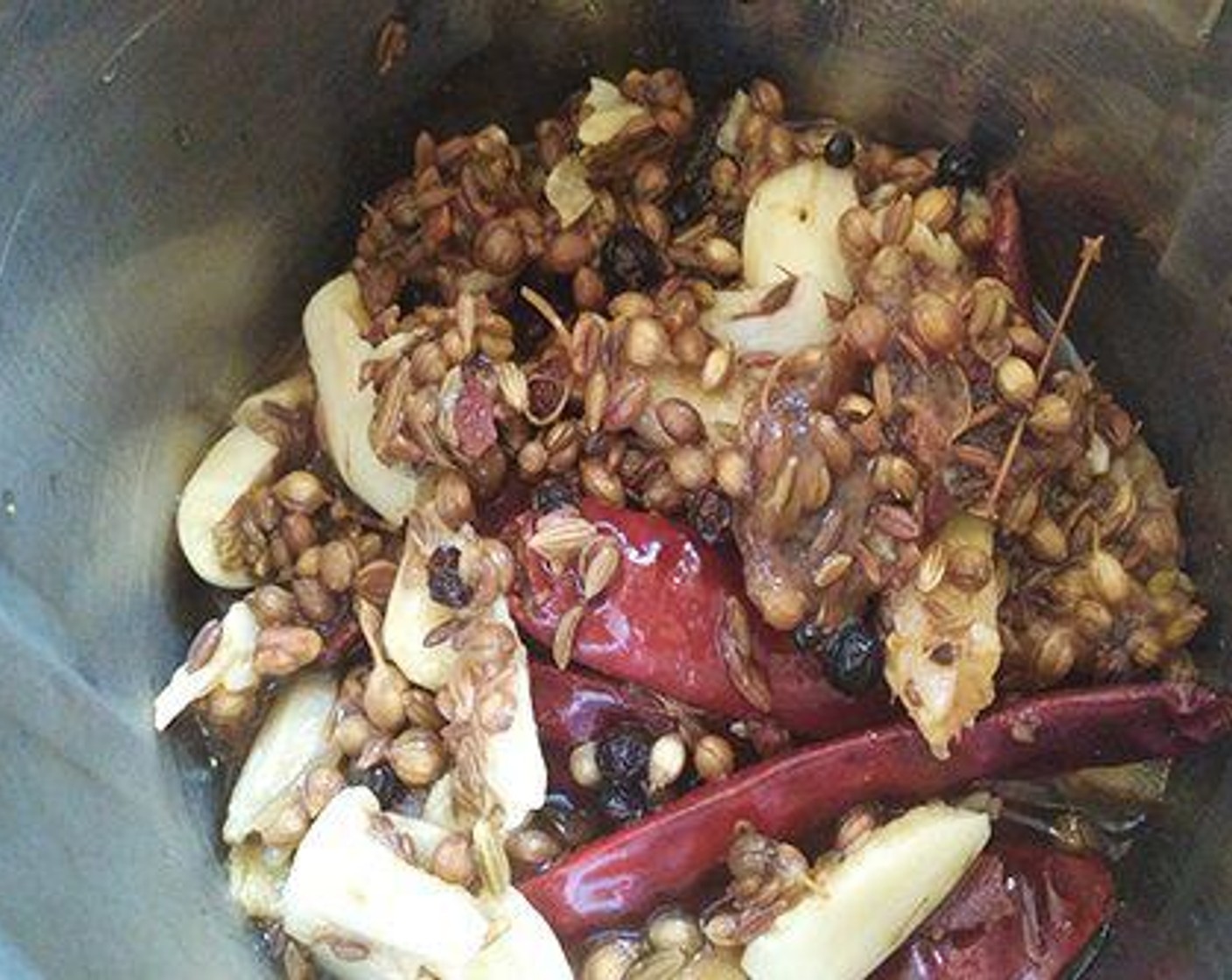 step 2 Dry roast Fennel Seeds (1/2 tsp), Cumin Seeds (1/2 tsp), Ground Black Pepper (1/2 tsp), Fenugreek Seeds (to taste), Cinnamon Stick (1 in), Whole Cloves (4), Fresh Ginger (1 piece), Garlic (6 cloves), Whole Coriander Seeds (1 Tbsp), and Red Chili Peppers (5) for a good eight to ten minutes in low flame in a pan.