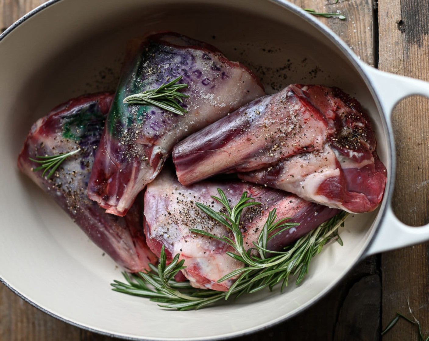 step 2 Using a large casserole, heat the Olive Oil (as needed), add in Fresh Rosemary (2 sprigs), and brown the Lamb Shanks (4), careful to color each side of the meat. Remove the shanks and rosemary and set them aside.