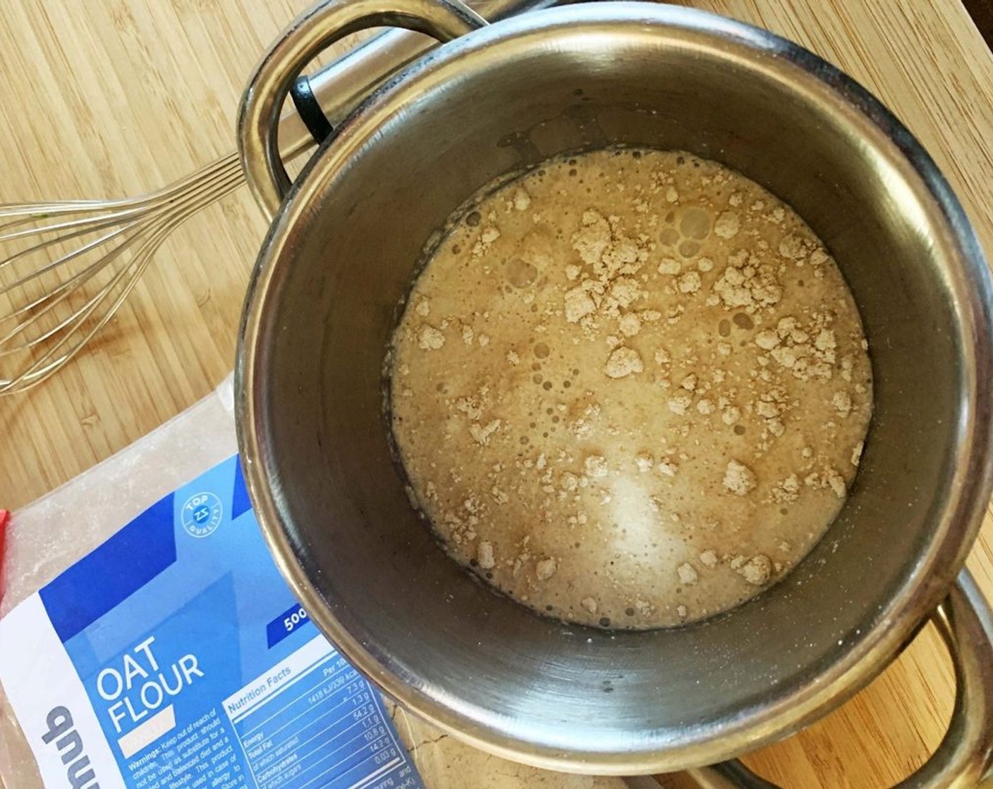 step 1 In a small saucepan, place Oat Flour (2 1/2 Tbsp) and Almond Milk (4 oz).