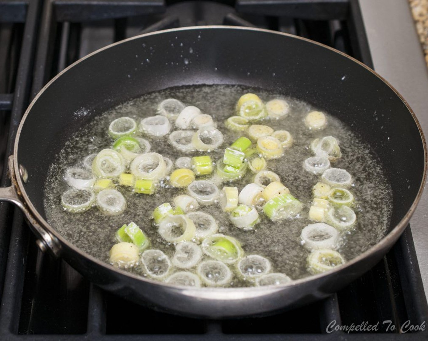 step 14 Fry for 4-5 minutes until golden, turning once. Using a slotted scoop remove leeks from oil and allow to drain on a paper towel lined plate. Repeat the frying process with remaining leeks. Keep uncovered at room temperature until ready to use.