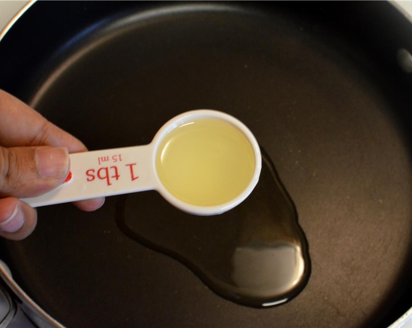 step 1 Heat some Olive Oil (2 Tbsp) in a deep pan.