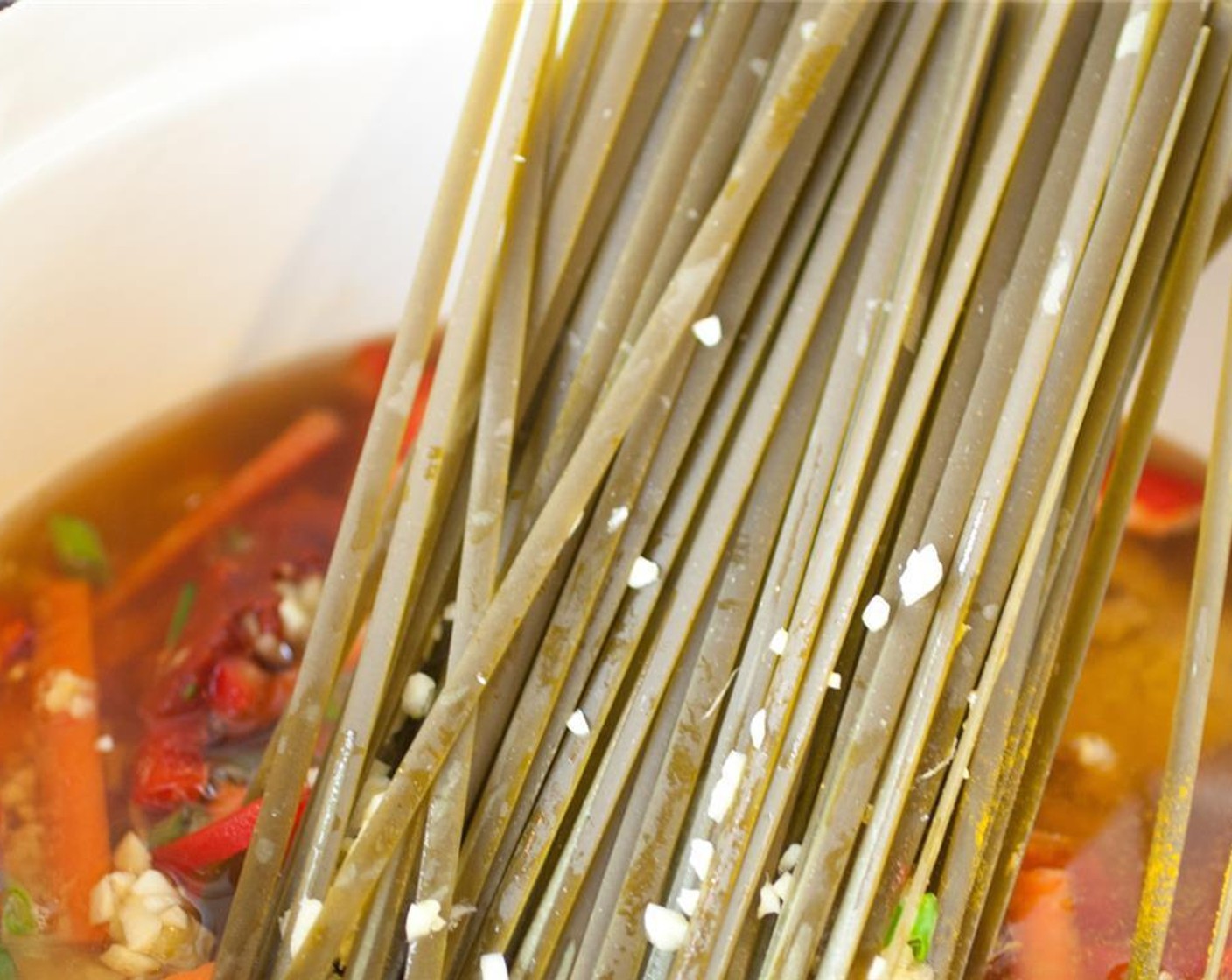 step 1 In a large soup pot, add Fettuccine (12 oz), Vegetable Broth (4 1/2 cups), Carrot (1), Red Bell Pepper (1), Scallion (1 bunch), and Garlic (4 cloves).