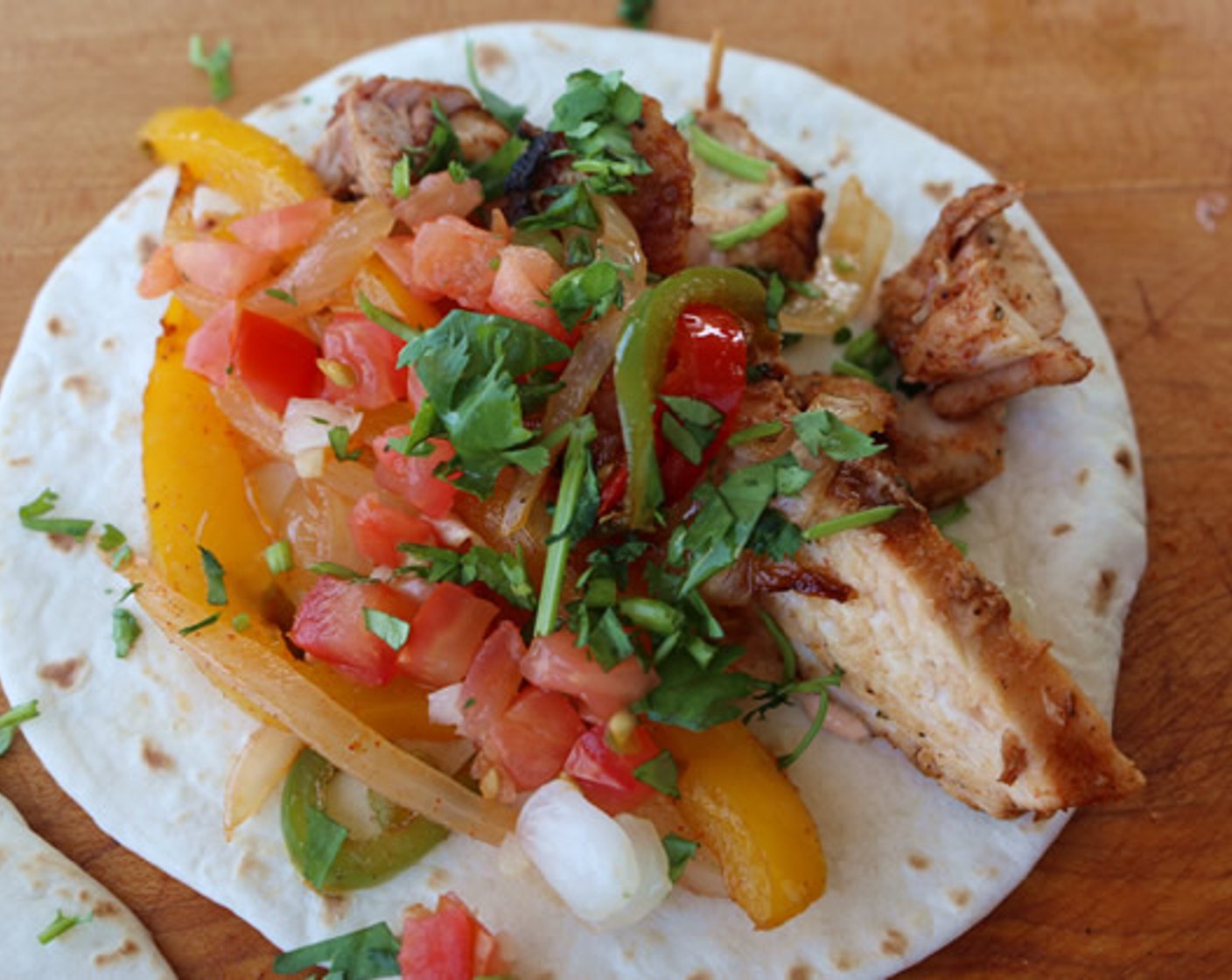 step 12 Squeeze fresh lime juice over the top and serve with warm tortillas, sour cream sauce, and remaining cilantro. Enjoy!