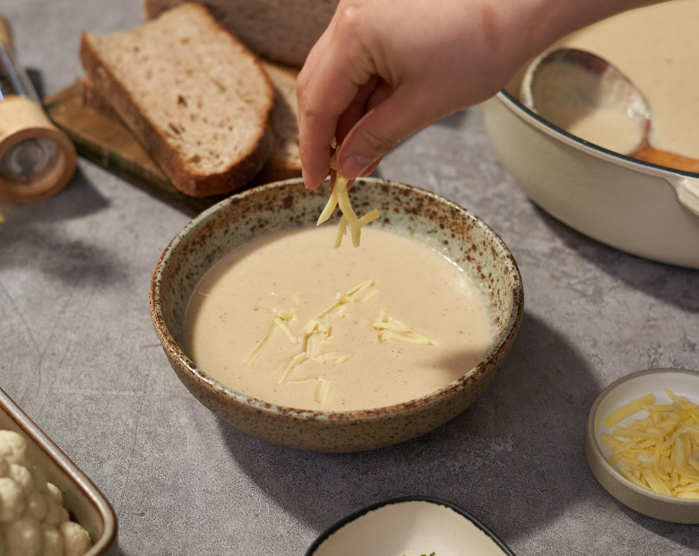 step 7 Serve the soup in a bowl with Sourdough Bread (to taste) on the side. Top with Shredded Cheddar Cheese (to taste) and Fresh Parsley (to taste).