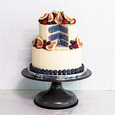 Tiered Cake with Multi-Colored Layers and Fresh Berries Recipe | SideChef