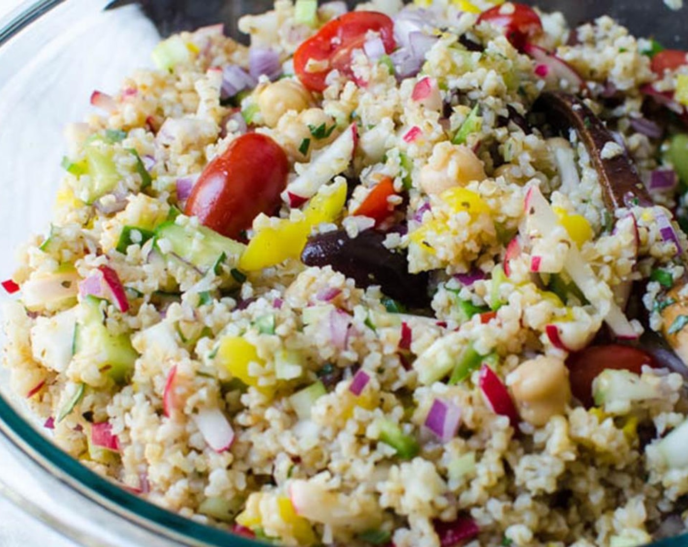 step 7 When the bulgur wheat has cooled to room temperature, add it to the chopped vegetables and toss to combine. Add about half of the dressing to the salad and toss until coated. Taste for seasoning.