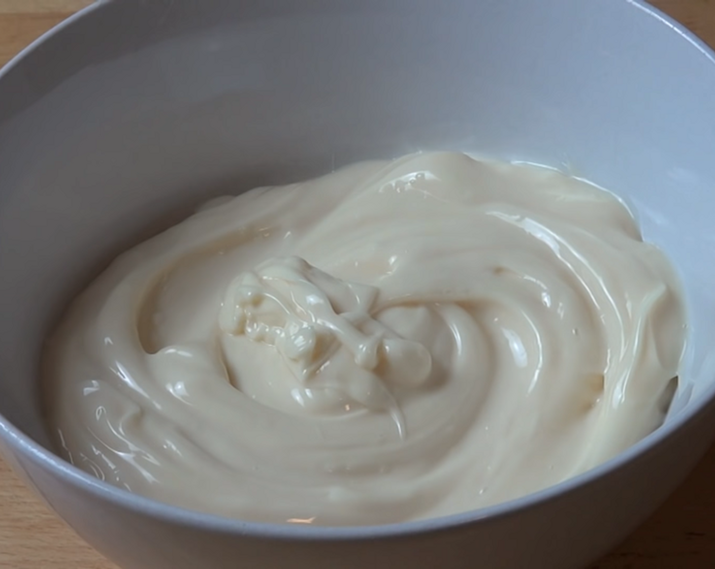 step 3 Into a mixing bowl, add your Mayonnaise (2 cups), Onion Salt (1/2 Tbsp), and McCormick® Garlic Powder (1 Tbsp). Season with some Freshly Ground Black Pepper (to taste) and mix everything together.