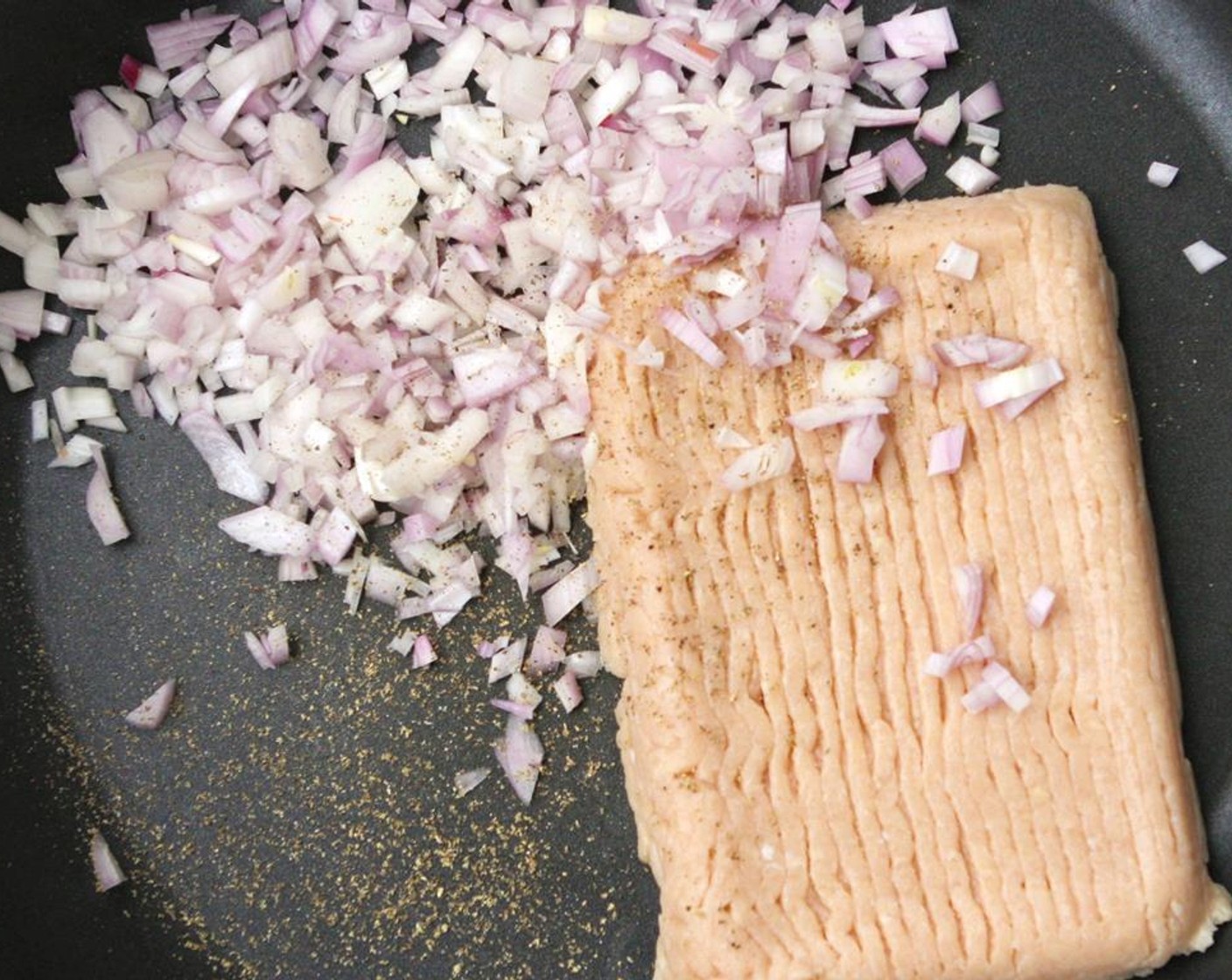 step 2 Heat a large skillet over medium heat. Add Ground Chicken (1 lb), shallots, Salt (to taste) and Ground Black Pepper (to taste) and cook, breaking chicken apart with a spatula, until the meat is almost cooked through.