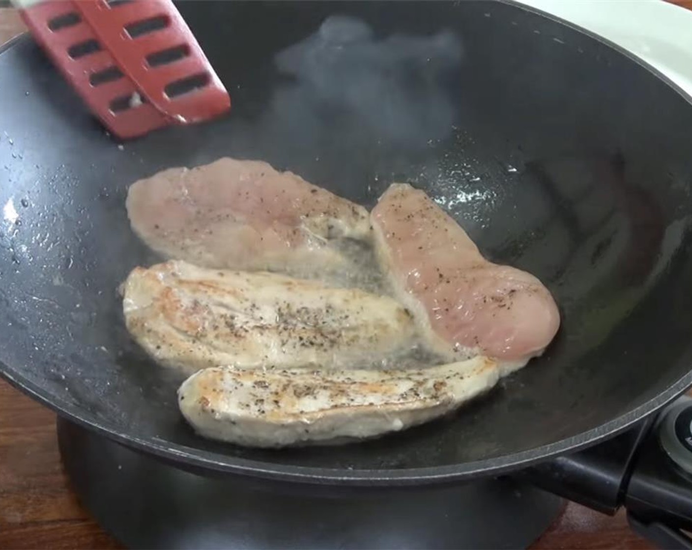 step 3 Place Coconut Oil (2 Tbsp) in a skillet and heat it. Once it is hot, start browning the chicken on both sides. Work in batches and place on a paper towel lined plate. Set the browned chicken aside.