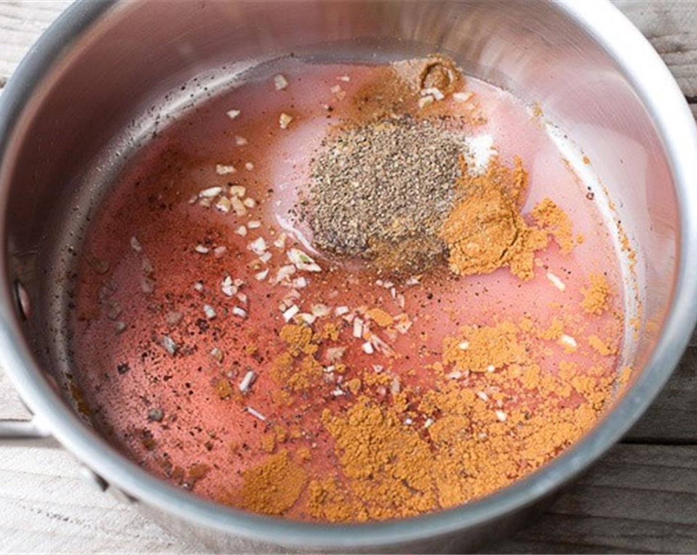 step 1 Add Garlic (2 cloves), Apple Cider Vinegar (4 Tbsp), Granulated Sugar (1/2 cup), Ground Cumin (1 tsp), Simply Organic Cinnamon, Ground (1/2 tsp), Dried Ginger (1 tsp), Ground Allspice (1/2 tsp), and Salt (to taste) to a pot. Heat the mixture until the sugar is dissolved.