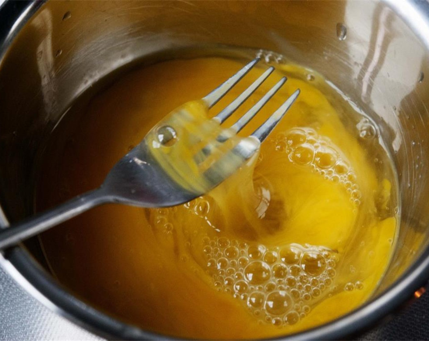 step 7 In a separate bowl, crack the Eggs (3) and beat the eggs slightly.