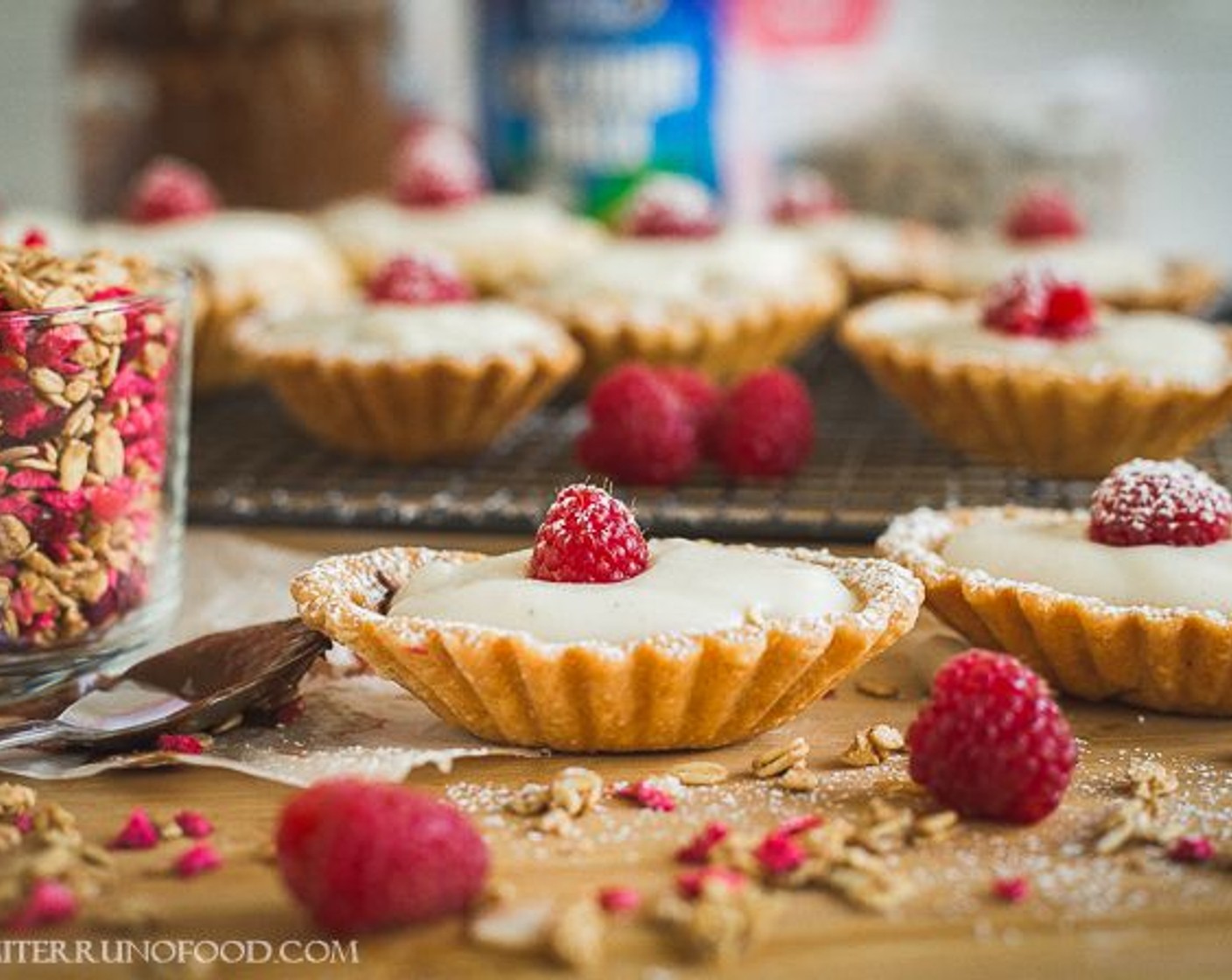 step 9 Finish the tarts with Fresh Raspberries (to taste) and a sprinkle of Powdered Confectioners Sugar (to taste).