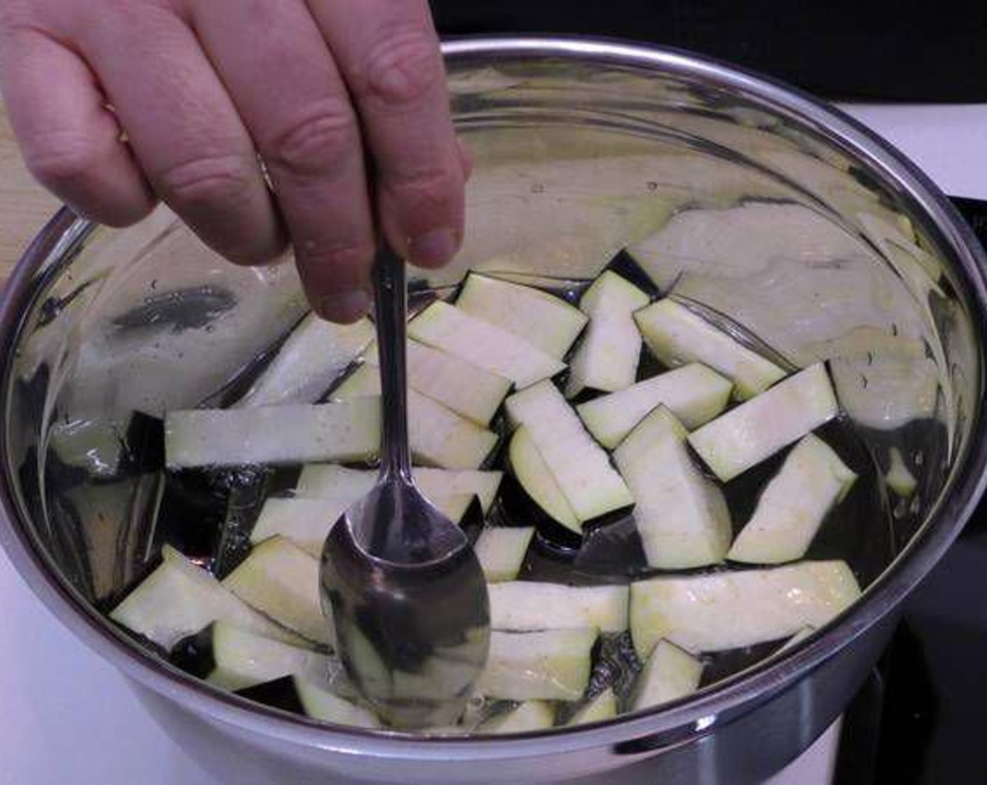 step 1 To remove the bitterness of the eggplant, cut Eggplants (4) into sticks and place them in a bowl with Water (to taste) and Salt (to taste). Let them soak for 15 minutes.