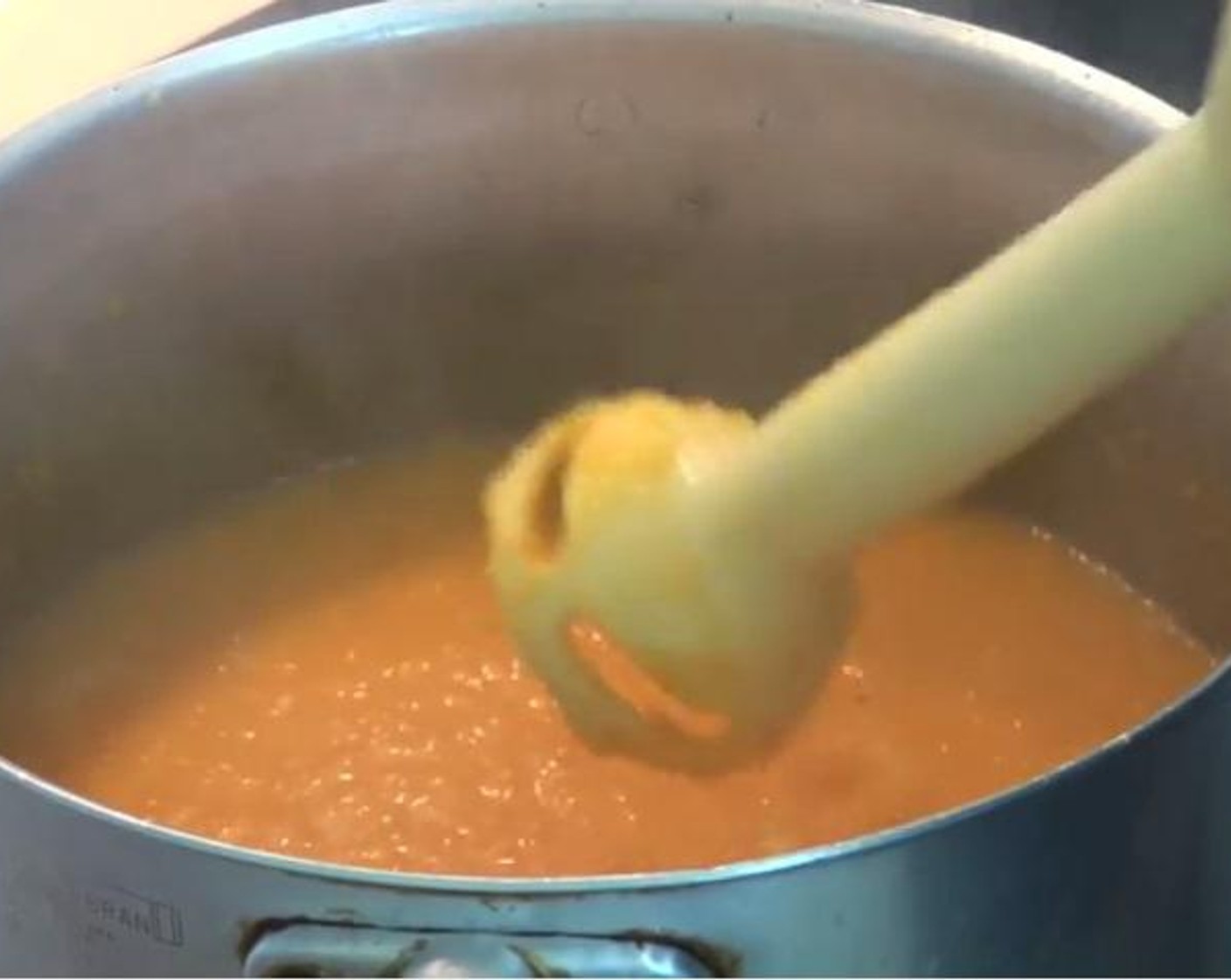step 3 When the mix comes to boil, Turn the temperature down to low and allow it to simmer for five minutes. Using a stick blender, blend your carrots until they are nice and smooth. Put the lid back on and allow it to simmer for another ten minutes.