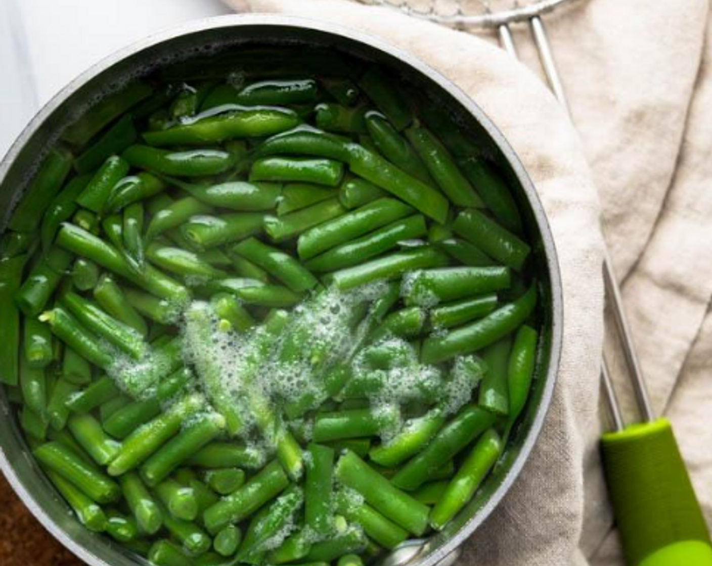 step 4 Bring a small pan of water to a boil and while the water heats, cut the beans into 1” pieces. Add 1 teaspoon of Salt (1 tsp) to the water once it boils and then add the Green Beans (2 cups). Cook the beans for 3-4 minutes or until crisp-tender.