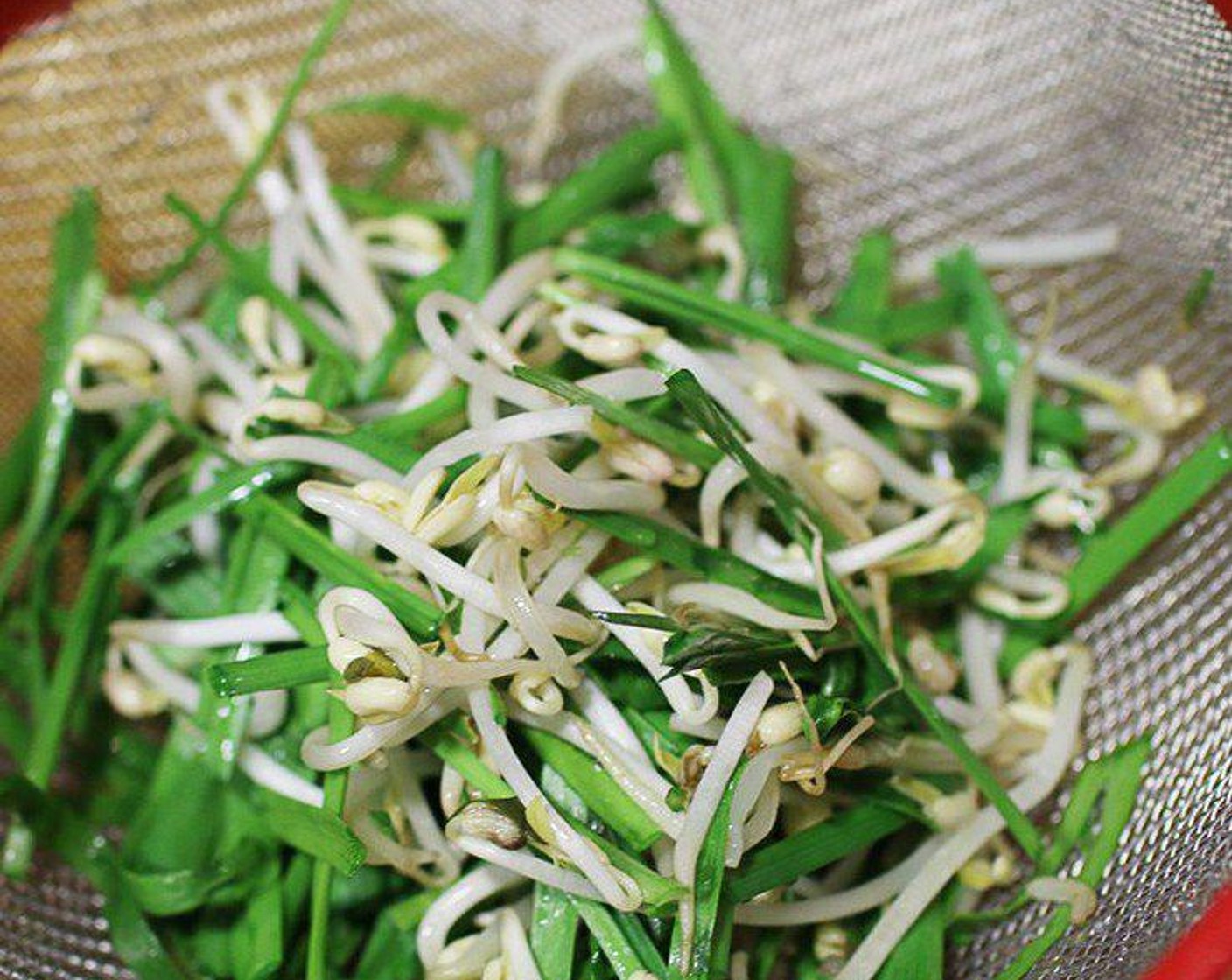 step 1 Rinse the Bean Sprouts (1/2 cup) and Chinese Chives (1/2 cup) and shake through a sieve to remove excess water, set aside.