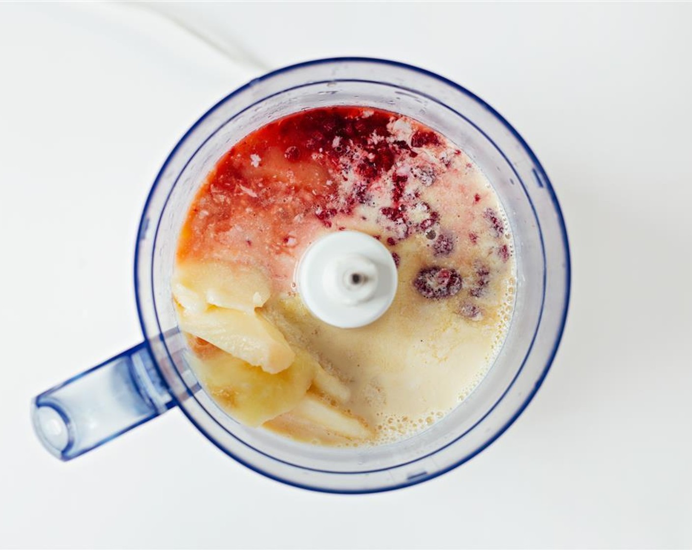 step 1 Blend Frozen Raspberries (4 Tbsp), Sliced Frozen Peaches (1), Milk (4 Tbsp), and Orange Juice (240 mL) in a food processor or blender and blend until smooth.