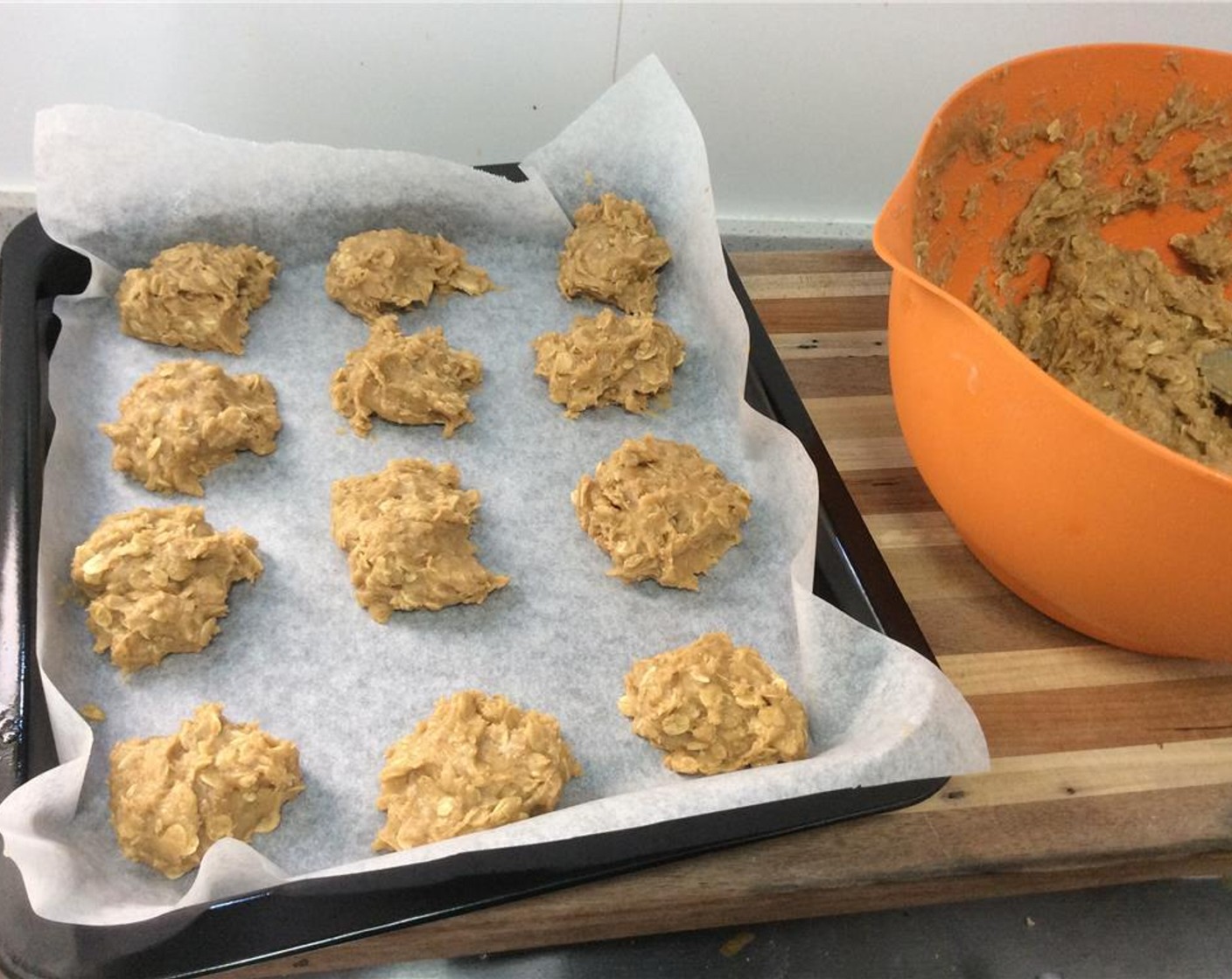 step 9 Lay wax paper onto a cookie sheet. Spoon the dough into walnut sized balls, and place 2-inches apart on the sheet.