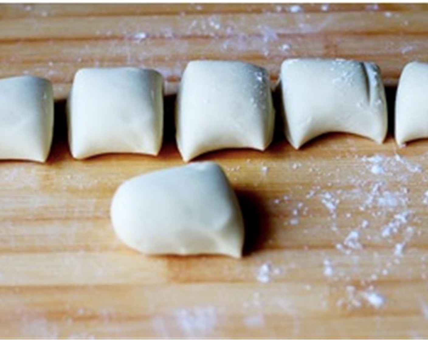 step 6 Knead the dough again to pinch the air out. Then roll the dough into a uniform long log around 5 cm in diameter. Cut the long log into 6 equal portions.