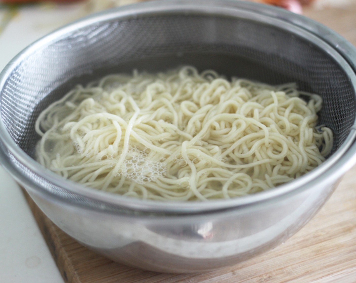 step 7 After boiling the noodles, strain all the hot water and keep them in cold water. This will help prevent the noodles from sticking together.