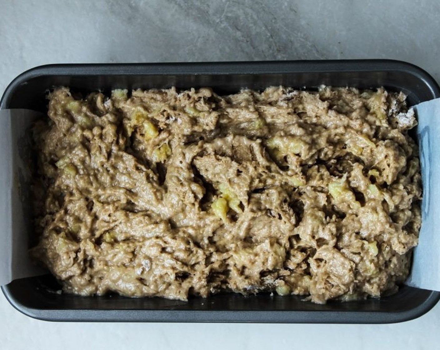 step 11 Pour the batter into the loaf pan. Once the oven has gotten up to temperature, add the loaf pan in and bake it for 45 minutes.