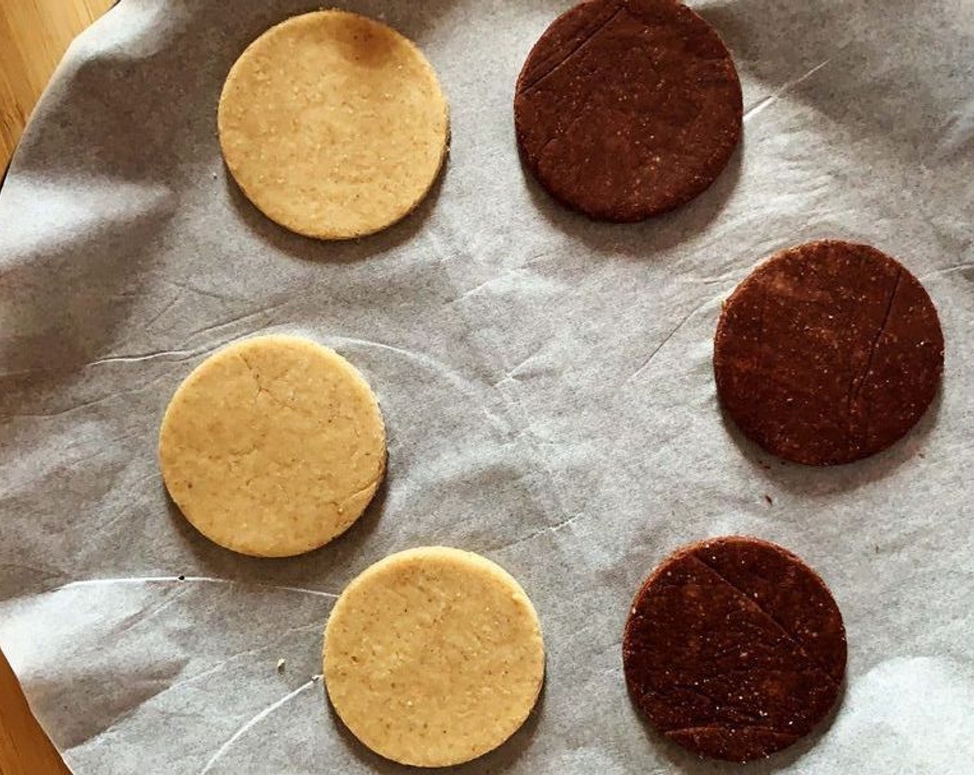 step 6 Roll it out and using round cookie cutters, cut out 4 rounds per flavor. Bake in preheated oven for about 15 minutes. Let the cookies cool down completely