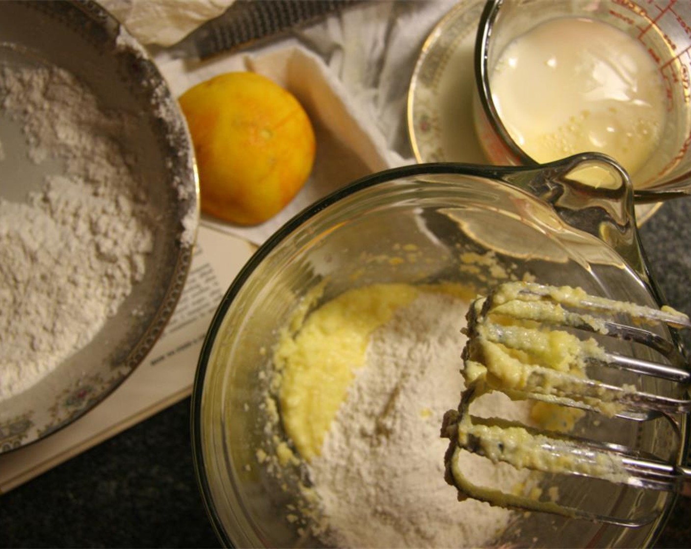 step 3 In another bowl, cream the Unsalted Butter (1/4 cup), zest from the Orange (1) and Granulated Sugar (1/2 cup) until light and fluffy. Add the Egg (1) and beat until incorporated. Mix in half of the flour mixture.