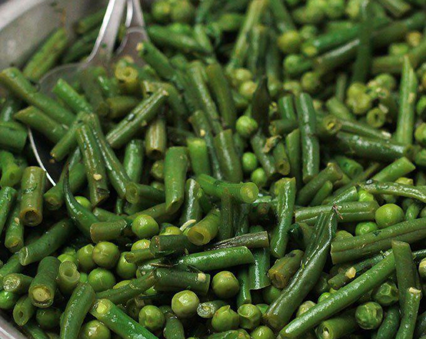 step 4 Add French Beans (3 cups), Green Peas (3 cups), Tarragon (1/2 Tbsp), Fresh Thyme (1/2 Tbsp), Italian Flat-Leaf Parsley (1 Tbsp), and Salt (to taste) to skillet and continue to sauté 1-2 minutes.