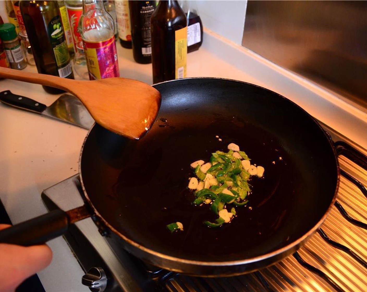 step 4 In a pan, heat the Olive Oil (1 Tbsp) and sauté the garlic and the chili pepper for about 1-2 minutes.