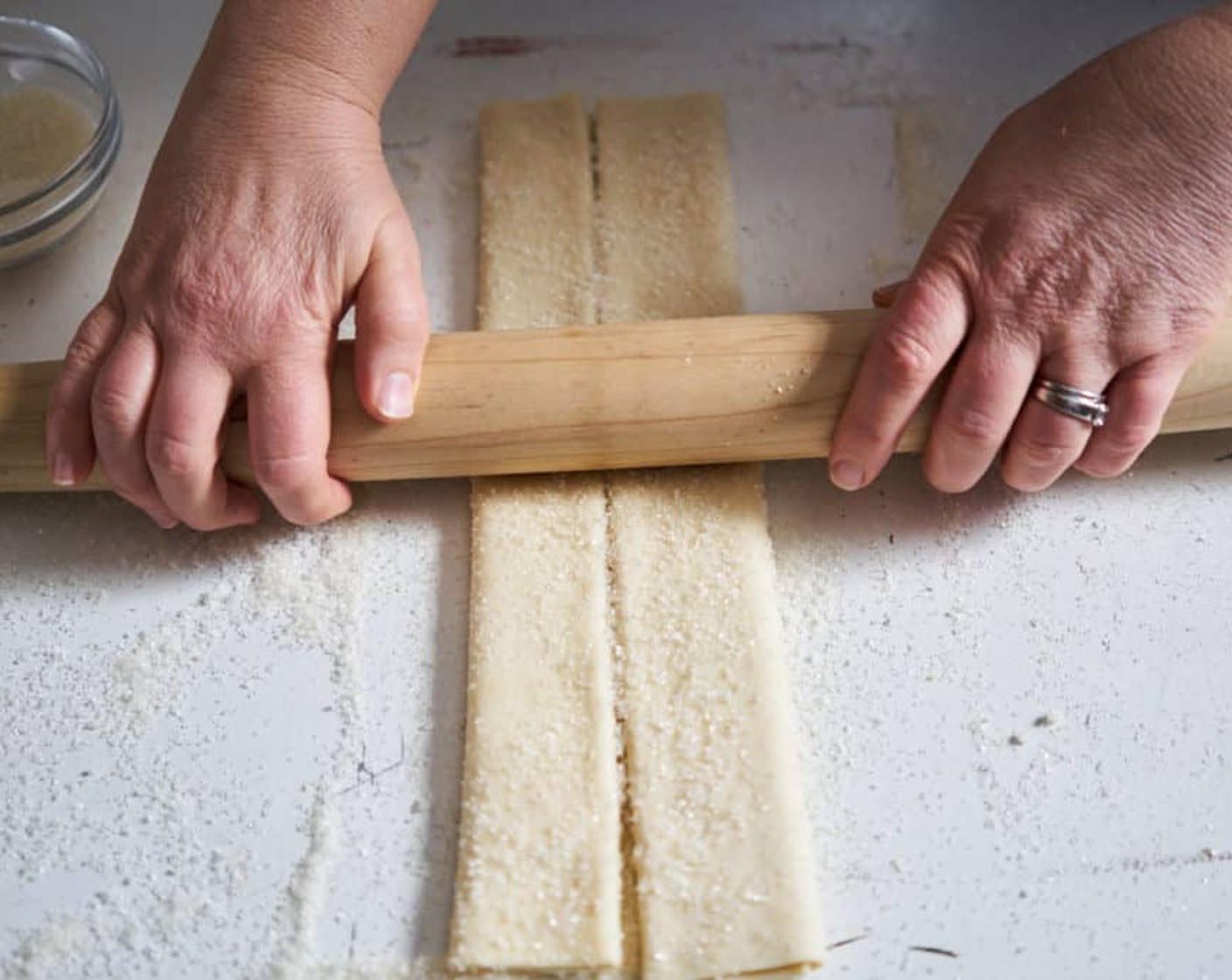 step 4 Using a rolling pin, gently roll down the sheet of puff pastry to deepen the creases so the rectangle will hold the shape. You don’t want it unfolding again!