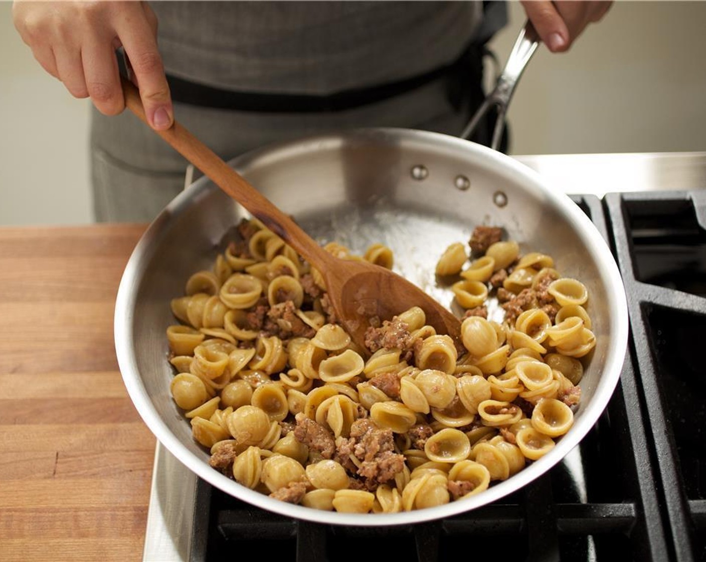 step 6 Add the Orecchiette Pasta (8 oz). Cook and stir until the liquid is absorbed.