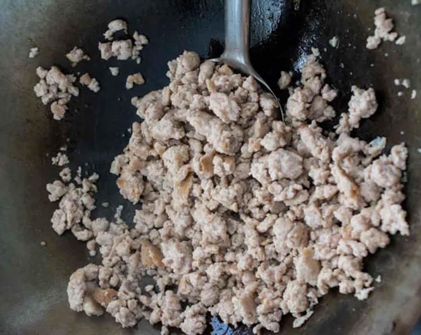 step 6 Heat Cooking Oil (2 Tbsp) in a wok over medium-high heat. Stir-fry the ground pork until mostly cooked, then remove the meat from the wok, and set aside.