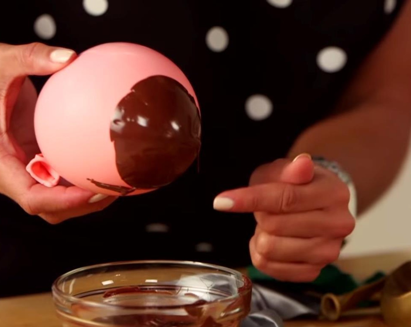 step 2 Dip the balloons in the Chocolate (2 cups), coating the bottom to form the desired "bowl" shape.