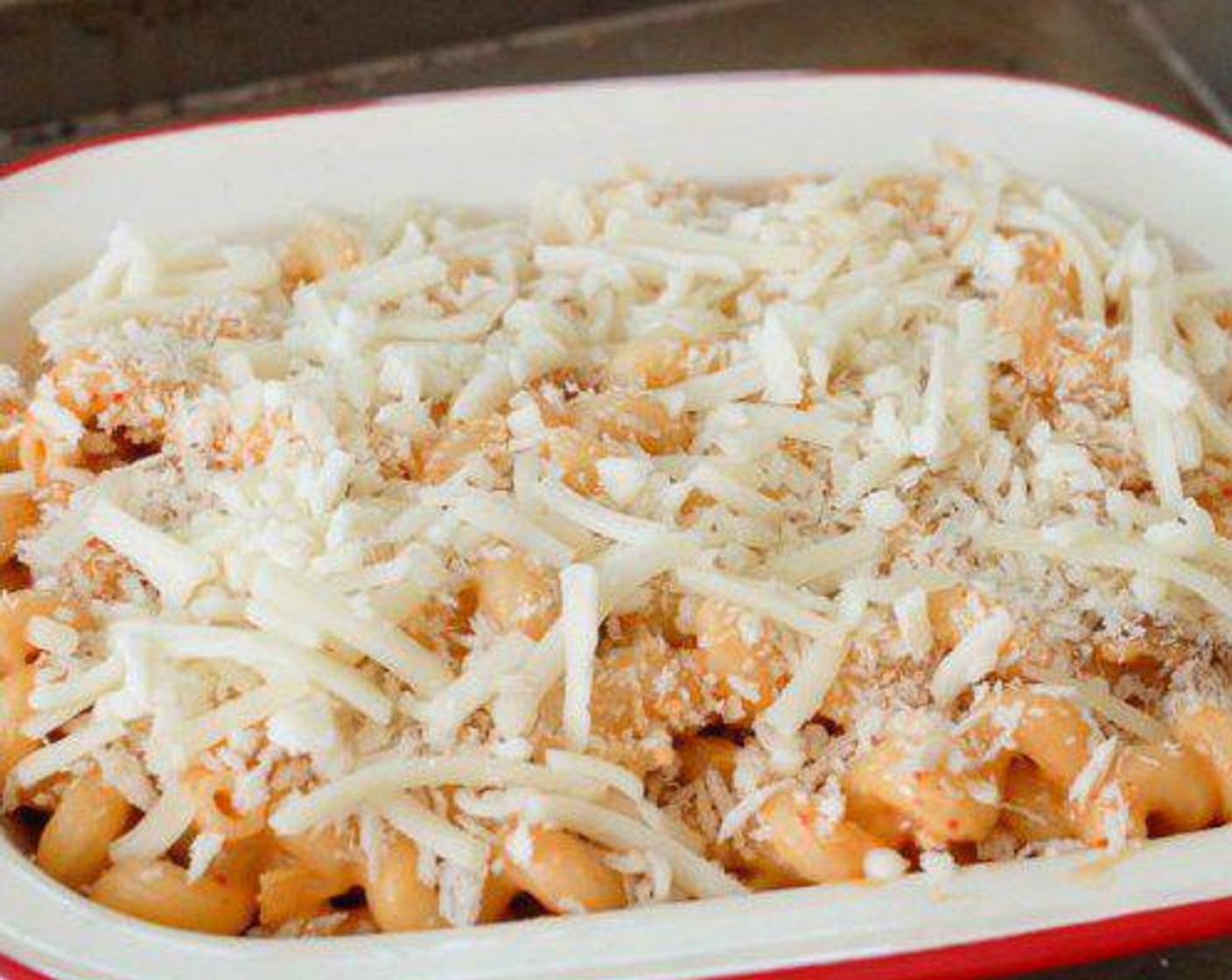 step 6 Transfer the macaroni into a baking tin, sprinkle cheese and Breadcrumbs (to taste) on top.