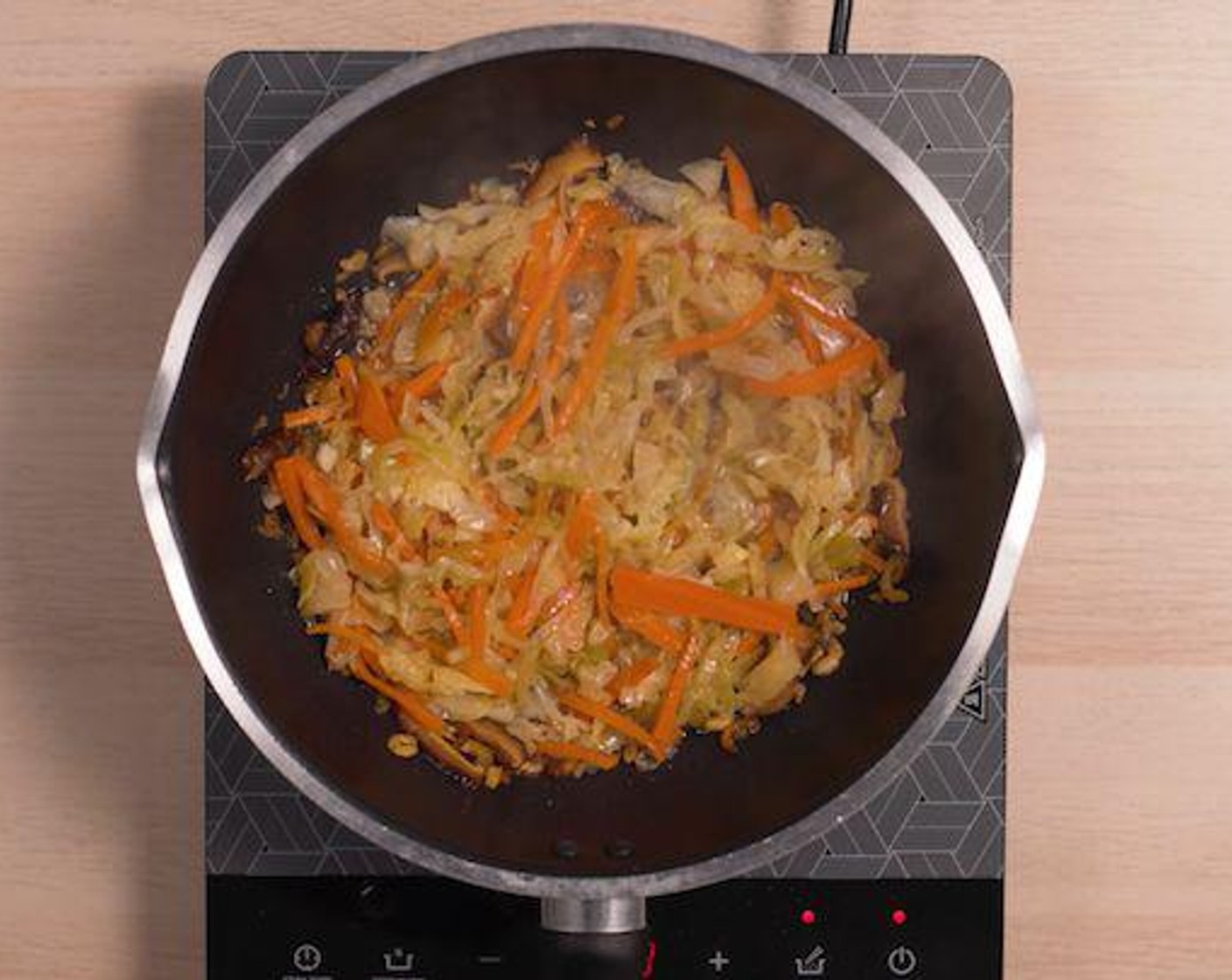 step 1 Heat Oil (2 Tbsp) in a pan. Add Dried Shrimp (1 oz) and saute till fragrant. Add Dried Mushrooms (2/3 cup) cook briefly, and pour in the Green Cabbage (5.5 oz) and Carrot (1 cup). Cook briefly.