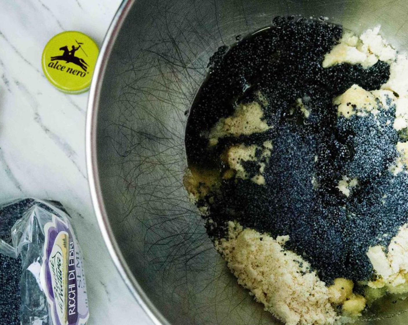 step 2 In a bowl, place Almond Flour (1 1/4 cups), Poppy Seeds (1 Tbsp), Extra-Virgin Olive Oil (1 Tbsp), Eggland's Best Classic Egg (1), and Pink Himalayan Sea Salt (1/4 tsp).