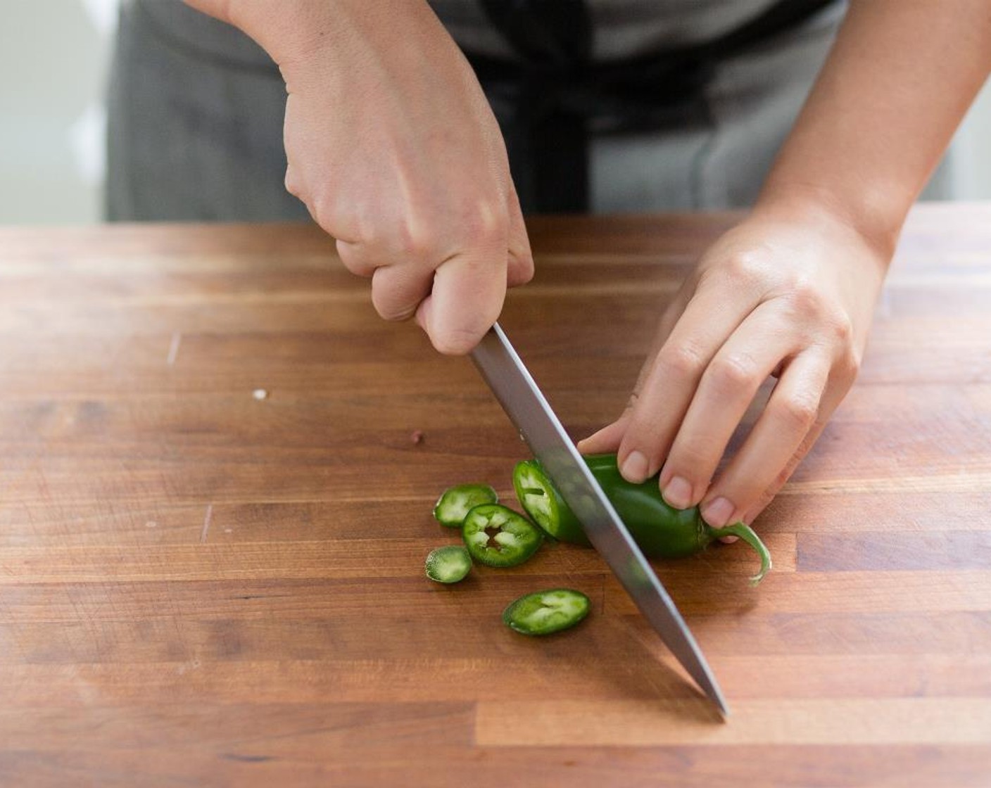 step 2 Cut the Jalapeño Pepper (1) on the bias into 1/4 inch sliced pieces; set aside.