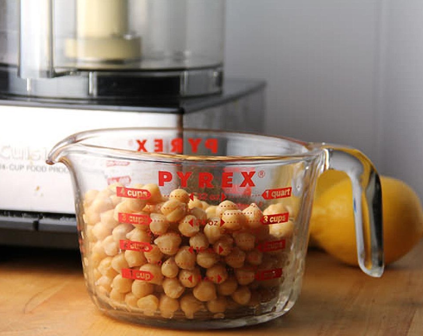 step 1 Put GOYA® Chick Peas (3 cups), Tahini (1/3 cup), juice from Lemons (2), Garlic (2 cloves), Water (4 Tbsp) and Kosher Salt (1 tsp) into the bowl of a food processor.