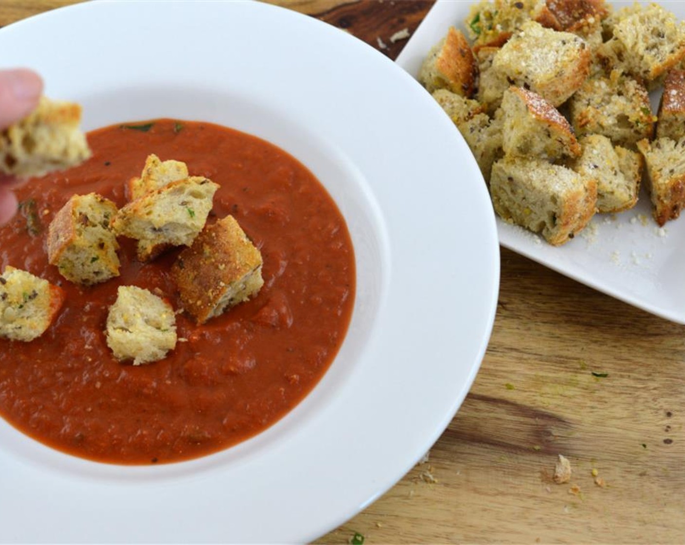 step 5 Stir in Heavy Cream (2 Tbsp) and Water (2 Tbsp). Take the soup off the heat and add the Fresh Basil (1 Tbsp). Sprinkle with croutons and serve.