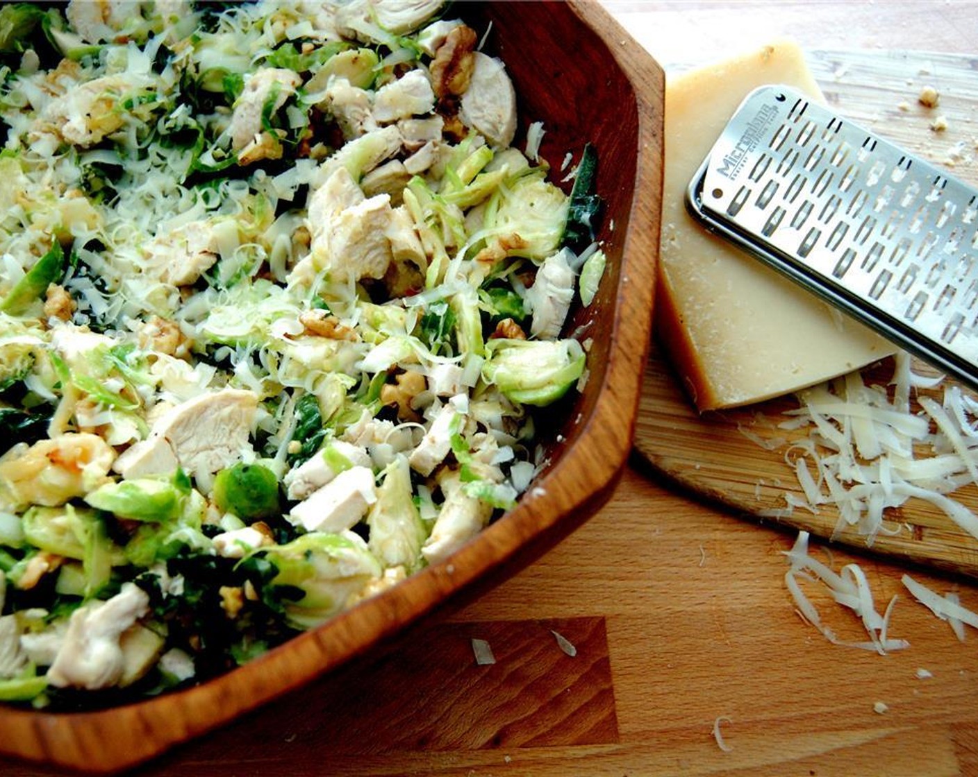 step 6 Toss together the vegetables, Parmesan Cheese (1/4 cup), Shredded Chicken (1 cup), walnuts and dressing. Serve warm or cold.