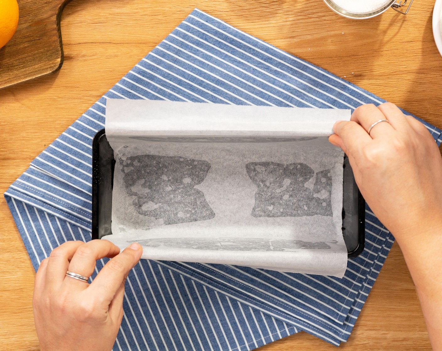 step 2 Line a loaf pan with parchment paper.